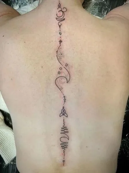 Minimalist spine tattoo