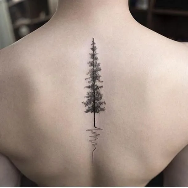 Natureinspired spine tattoo