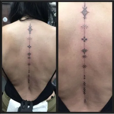 Symbolic spine tattoo