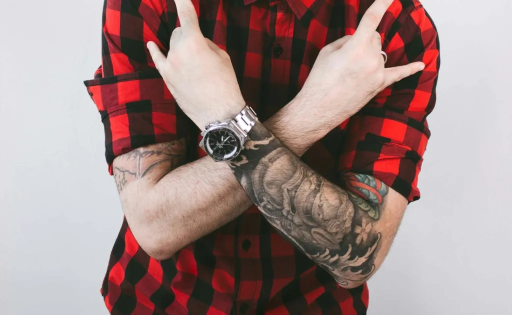 a guy with huge tattoo on arm