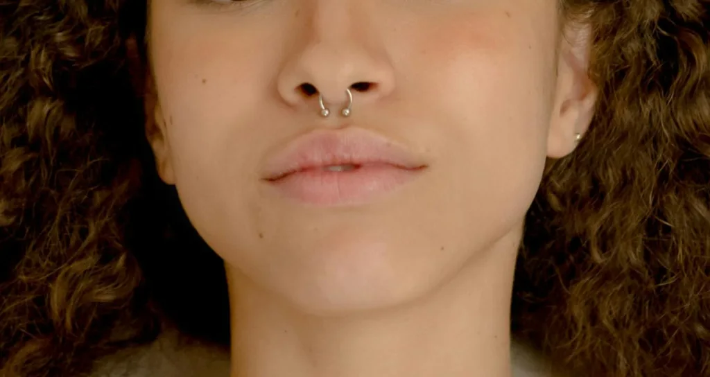 a girl with simple nose piercing